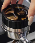 Slick 58mm Coffee Distributor Needle With Geared Spinning Action And Sturdy Black Base, Smooth Espresso Leveler in use.