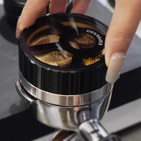 Slick 58mm Coffee Distributor Needle With Geared Spinning Action And Sturdy Black Base, Smooth Espresso Leveler in use.