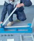 Person assembling Beefy Built Tough Miter Saw Stand Supports Up To 500 Lb with frame components on the floor.
