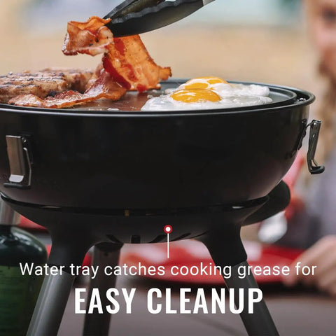 Four In One Portable Propane Grill With Stove Griddle And Wok Attachments showing bacon and eggs cooking on griddle, water tray visible