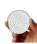 Top Shelf Reusable Espresso Puck Screen Built From Heavy Duty 304 Stainless Steel Fits 51mm 54mm And 58mm Baskets held in hand.