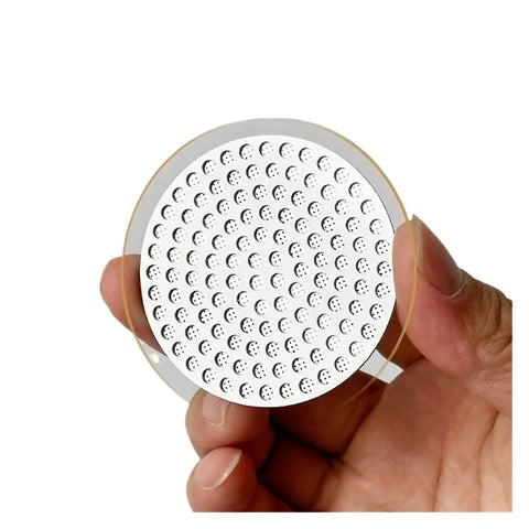 Top Shelf Reusable Espresso Puck Screen Built From Heavy Duty 304 Stainless Steel Fits 51mm 54mm And 58mm Baskets held in hand.