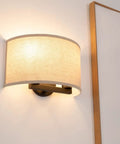 2 Light Linen Fabric Boho Hallway Wall Sconce Indoor Light Fixture Dual Vintage Industrial Hardwired Half Moon Semicircle Textile Shade Cozy Chic Vibe With E26 Socket For Bedroom Living Room Corridor And Study mounted on a wall next to a framed picture.