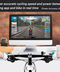 Cyclist using Smart Wheel On Bike Trainer With Bluetooth And ANT Plus Connectivity for Zwift on virtual ride setup with monitor