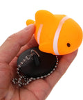 Fish Bathtub Drain Stopper with Chain Rubber for Shower Drains held in hand, featuring orange fish design and black base.