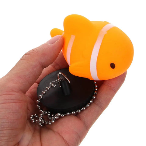 Fish Bathtub Drain Stopper with Chain Rubber for Shower Drains held in hand, featuring orange fish design and black base.