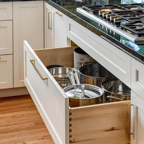 Six Pack Antique Brass Cabinet Pulls Featuring Rock Solid Grooved Grip For Reliable Everyday Drawer Swings And Quick Kitchen Remodels Or Bathroom Vanity Refreshes in a kitchen drawer with pots and pans.