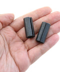 Hand holding Two Piece 1/2 Inch To 1/4 Inch Router Collet Reducer Sleeve For Drill Bits In Black A3 Carbon Steel, DIY Friendly tool.