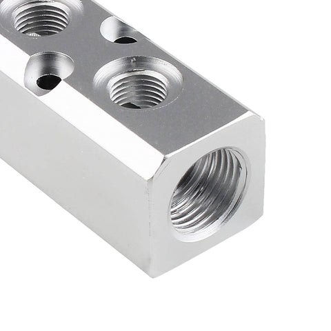 Close-up of Two Way Pneumatic Manifold Air Distribution Block Ready To Roll Heavy Duty Aluminum Design With Two Inlets And Two Outlets 18mm Inlets 12mm Outlets Mounting 5mm Quick Connects For Compressors And Air Tools, showing threaded connections.
