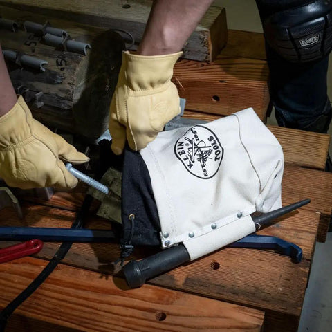 Hands inserting bolt into Top Closing Bolt Bag With 3 Inch Drawstring, Load Rated Tool Bag For 5 X 10 X 9 Inches, Built Tough No 4 Canvas