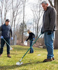 People using 36 inch reacher grabber tool for yard cleanup, showcasing ergonomic grip and magnet for easy trash pickup.