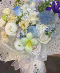 Bouquet wrapped in blue Five Sheet Flower Wrapping Mesh Paper In 19.68 Inches By 27.56 Inches Perfect For Bouquets And Gift Packaging