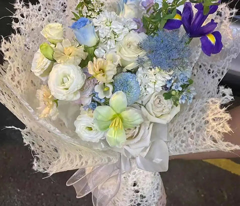 Bouquet wrapped in blue Five Sheet Flower Wrapping Mesh Paper In 19.68 Inches By 27.56 Inches Perfect For Bouquets And Gift Packaging
