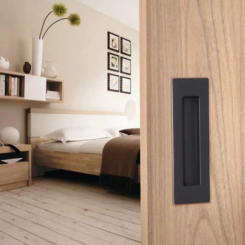 Flush Pull Handle Set 6 Inch Rectangular Oil Rubbed Bronze on wooden sliding barn door in modern bedroom setup