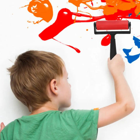 Child using 3 Pack Slick Glide Plastic Ink Rollers for Printmaking and Diamond Art Projects applying paint on a wall.
