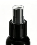 Close-up of Frosted Glass Spray 30ml Anti-Glare Translucent Portable Agent with black nozzle and cap.