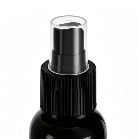Close-up of Frosted Glass Spray 30ml Anti-Glare Translucent Portable Agent with black nozzle and cap.