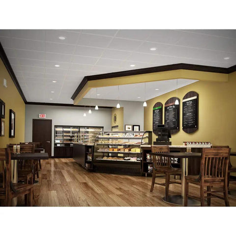 Cafe interior with RL Series 5/6 Inch Recessed LED Retrofit Downlight With White Baffle Trim providing smooth, efficient lighting