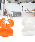 Restokki Bathtub Drain Hair Catcher 2pcs White Orange with Handle in a bathroom, showcasing the hair catchers and their colors.