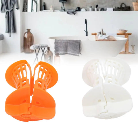 Restokki Bathtub Drain Hair Catcher 2pcs White Orange with Handle in a bathroom, showcasing the hair catchers and their colors.