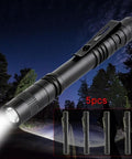 Five Pack Pen Light Flashlights With Clip Ultra Bright Q5 LED Mini Pocket Flashlights illuminating a path at night