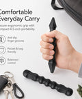 Hand holding 2-Pack Yawara Stick Set 6.5 Inch High Impact Polymer For Self Defense And Training, ergonomic grip next to keys.