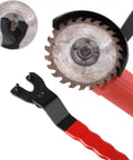Heavy Duty Adjustable Pin Wrench For Angle Grinders with chisel steel body and red grippy handle beside a grinder blade.