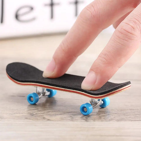 Mini Finger Skateboard With Maple Wood Deck, Deep Concave And High Kick, shown on a table with blue wheels.