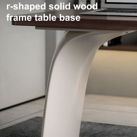 Close-up of the r-shaped solid wood frame table base of the Slick Oversized L Shaped Home Office Desk.
