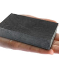 Heavy Duty Graphite Ingot Block 100mm x 50mm x 25mm for milling surface melting and casting moulds with 99.9 percent purity held in hand