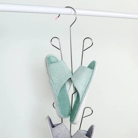 Heavy Duty Stainless Steel Hanging Shoe Rack With Double Nonslip Hooks displaying green and gray slippers securely organized.