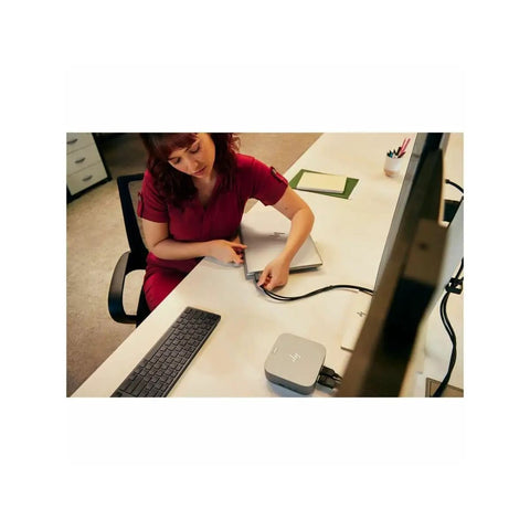 Woman connecting laptop to Beast Mode Thunderbolt 4 Docking Station With 280 Watt PD Fast Charging on a desk