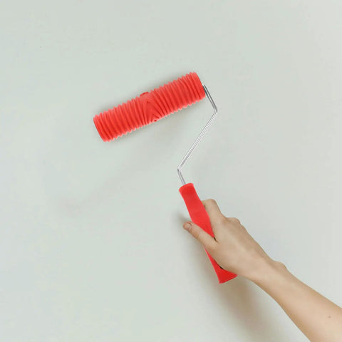 Kick Some Serious Flair Into Your Walls Using This Heavy Duty Ceiling Texture Roller With A Sturdy Plastic Handle To Nail That Perfect Straight Grain Pattern On Drywall Today, 12-inch red rubber grain roller in use.