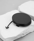 Black front bumper tow hook cover cap for Toyota Prius 2004 2009 replacement part 52127 47010 on white background.