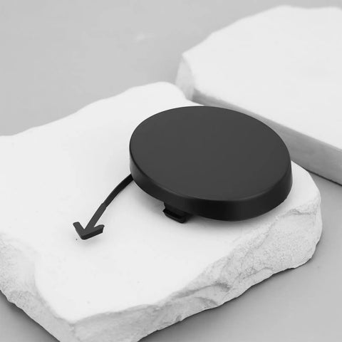 Black front bumper tow hook cover cap for Toyota Prius 2004 2009 replacement part 52127 47010 on white background.