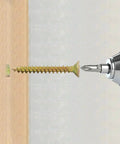 Drill inserting gold screw into wood from the 20 Pack Gold Anchors And Screws Kit For Hollow Walls With Tree Shape Expansion, 6x32mm