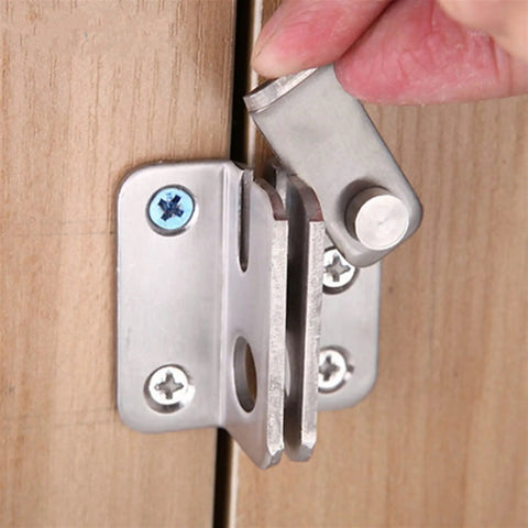Close-up of a Stainless Steel Spring Latch Lock Bolt Door Gate Cabinet Furniture Hardware being installed on a wooden door.