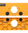 Hinge drilling jig for cabinet doors; orange plastic body with central round hole, adjustable dials, and hex key.