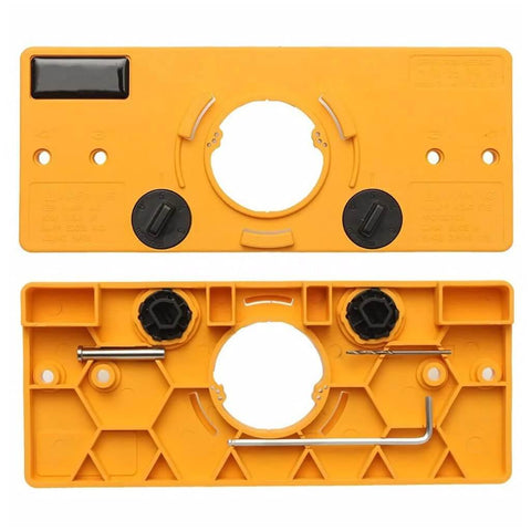 Hinge drilling jig for cabinet doors; orange plastic body with central round hole, adjustable dials, and hex key.