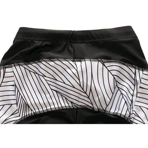 Black leggings with white geometric design waistband, close-up view