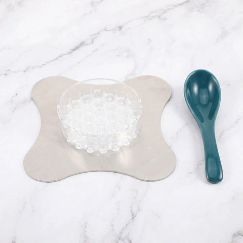 Total Game Changer Metal Coffee Drip Assist Tool And Portable Pour Over Dripper Stand With Rugged Filter Cone Holder features a honeycomb holder and spoon.