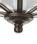 Close-up of antique bronze base of 4 Light Beveled Glass Close To Ceiling Indoor Light Fixture In Antique Bronze With Clear Geometric Panels
