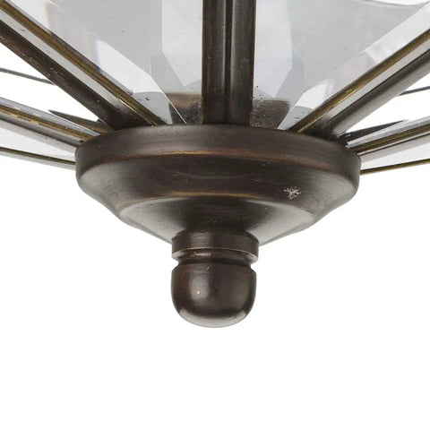 Close-up of antique bronze base of 4 Light Beveled Glass Close To Ceiling Indoor Light Fixture In Antique Bronze With Clear Geometric Panels