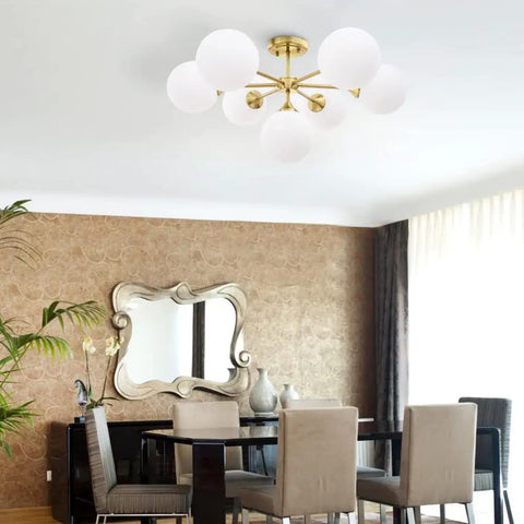 Gold Seven Light Glass Globe Sputnik Chandelier Pendant for Foyer Kitchen Dining Living Room Rustic Vintage Modern Metal Ceiling Fixture Semi Flush Mount Large Hanging Lamp showcased in elegant setting.