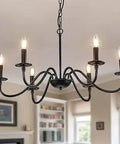 Vintage style chandelier with six lights in a living room setting.