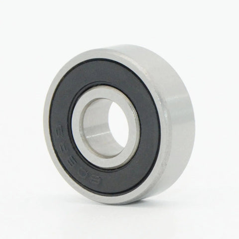 Front view of miniature sealed deep-groove ball bearing with silver outer race and black seal
