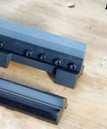 6 Inch Vise Mount Metal Brake Bender Attachment For 4 Inch Or Wider Vises That Bends 14 Gauge Steel And Two Millimeter Mild Steel, Also Handles One Eighth Inch Aluminum, With Removable Hardened Finger Dies One, Two, Three Inches on a wooden surface