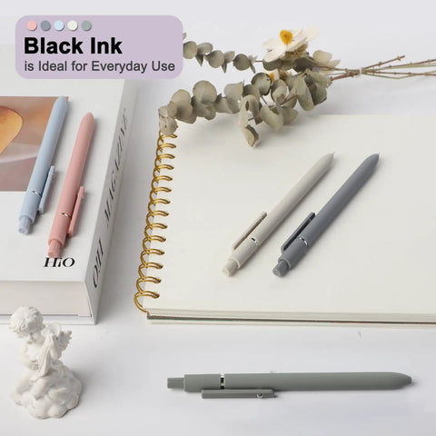 Go To Gel Pens Set Five Premium Retractable Gel Pens With Quick Dry Ink Fine Point Smooth Black Ink on a notebook