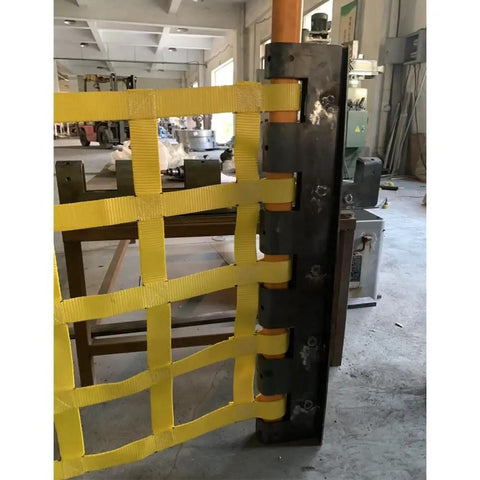 Rock Solid Heavy Duty Lifting Sling Net With Rugged Nylon Webbing For Safe Truck Trailer Towing And Equipment Rigging That Handles Three Tons Without Sweating In Rough Conditions While Keeping Gear Locked Tight On Every Daily Grind Project - close-up of yellow nylon webbing sling with metal attachment.