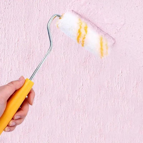 A person using the Slick 10 Piece Mini Paint Roller Covers Heavy Duty Acrylic Dripless Wall Wood Fabric Decorating Kit on pink wall.